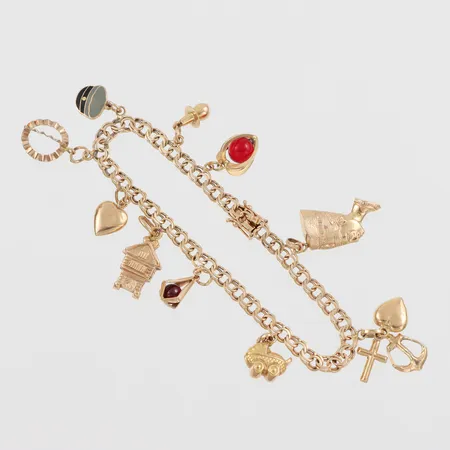 Armband med 10 st berlocker, längd ca 18.5 cm, bredd 4.4 gram, 18k. Vikt: 16,4 g
