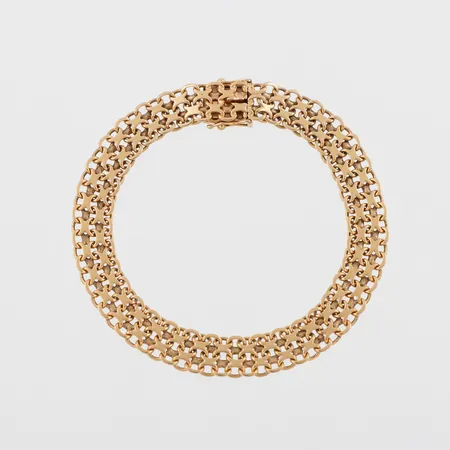 Armband X-länk, längd ca 19 cm, bredd 8.6 mm, 18k. Vikt: 15,8 g