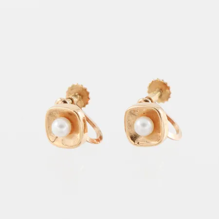 Örhängen paret med skruv och pärlor, diameter ca 7.8 mm, 18k. Vikt: 1,7 g
