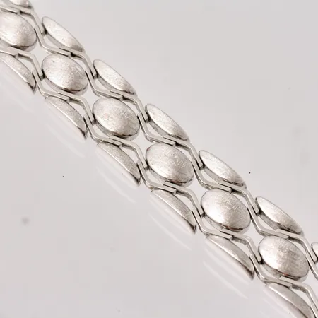  Armband i rodinerat silver, 19cm, bredd 13,mm, 835/1000, vikt 23,04g.