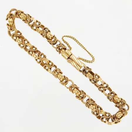 Armband, längd ca 21,5cm, bredd ca 6mm, med säkerhetskedja, 18K Vikt: 27,6 g