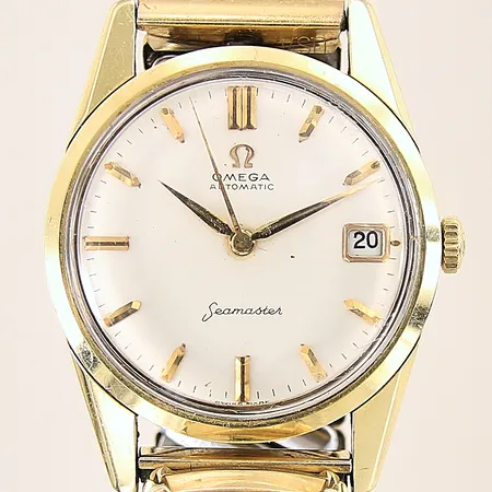 Herrur Omega Seamaster, guld/stål, automatisk, boett-nr: 14701 3 SC, serie-nr: 1760838, kaliber: 562, Ø33mm, flexband i doublé ej original, datum, boett, länk samt plexiglas med repor, delar i urverket angripna av rost, mindre fläckar i urtavla, inga tillbehör
