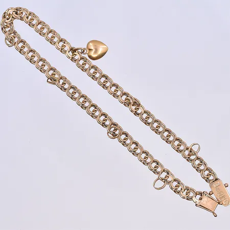 Armband Bismarck med en berlock och berlock ringar, längd 20,5 cm, bredd 5 mm, 18K. Vikt: 8,8 g