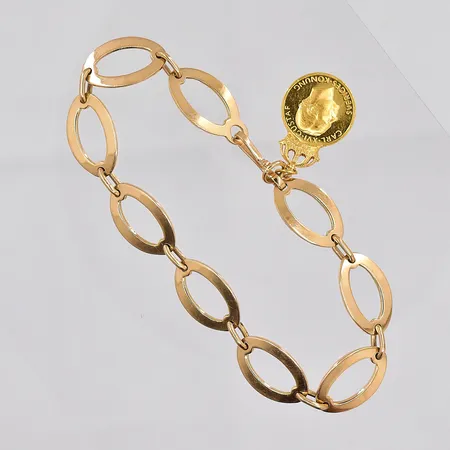 Armband, 20cm, bredd ca 11,2mm, med berlock, graverad, 18K Vikt: 19,4 g