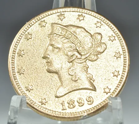 Guldmynt Liberty Head 10 Dollars 1899,  21,6k, spår av lödning Vikt: 16,6 g