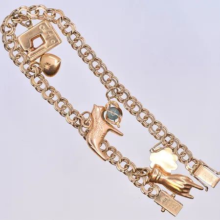 Armband Bismarck med berlocker, längd 19,5 cm, bredd på länk 5 mm, 18K. Vikt: 17,2 g