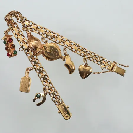 Armband X-länk med sju berlocker, längd 19cm, bredd 7mm, defekta öglor, 18K Vikt: 26,3 g