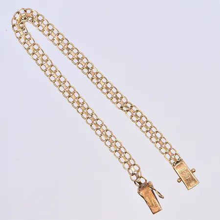 Armband X-länk, längd 18 cm, bredd 5 mm, några länkar böjda, 18K. Vikt: 5,8 g