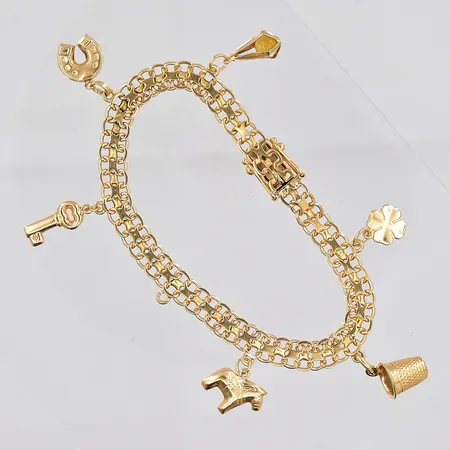 Armband X-länk med 6 berlocker, 19cm, bredd 6,8mm, en berlock saknas,18K Vikt: 16,3 g