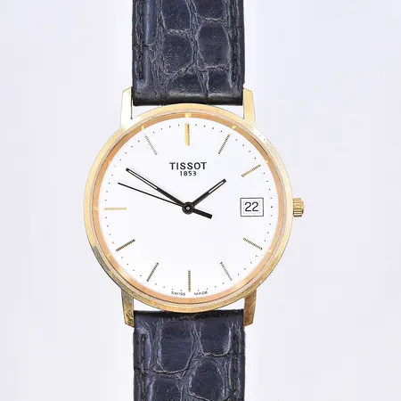 Herrur Tissot, quartz, datum, Ø33 mm, graverad boett, svart läderband, etui medföljer, 18K. Bruttovikt 31,9g.