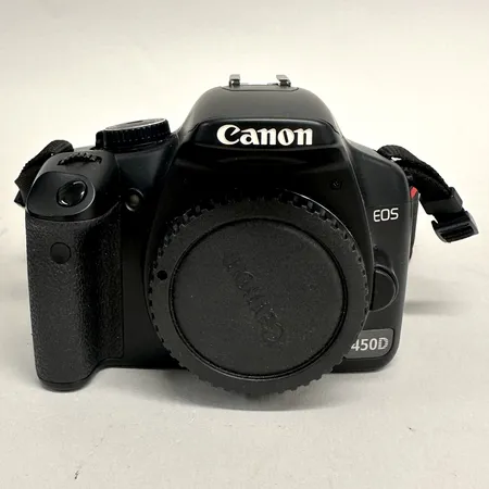 Digitalkamera Canon EOS 450D, ser 0680231500, år 2008, 1 Objektiv Canon EF-S 18-55mm, 1 Objektiv Sigma DG 70-300mm, filter, 1 Battery Grip Canon BG-E5, 3 batterier, 1 batteriladdare, kablage, väska, användarhandbok  Vikt: 0 g Skickas med postpaket.