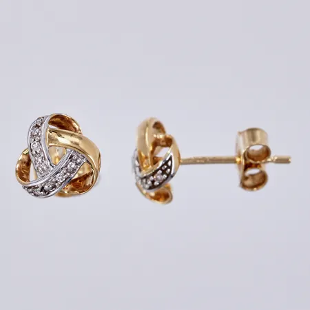 Ett par örhängen vitguld/gult guld med diamanter ca 8x0,005ct, Ø ca 8mm, GHA, 18K Vikt: 1,6 g