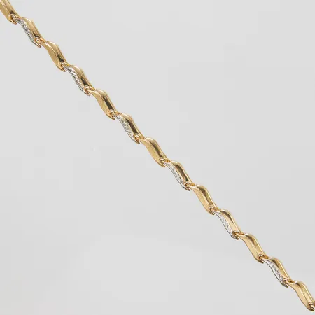 Armband, tvåfärgad, längd 19cm, bredd 4,5mm, ihålig, 14K. Vikt: 3,7 g