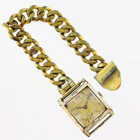 Armbandsur 14K, 25x30mm, manuell, fungerar ej, defekt urtavla och glas, defekt kedja i gulmetall, bruttovikt 54,1g, inga tillbehör.