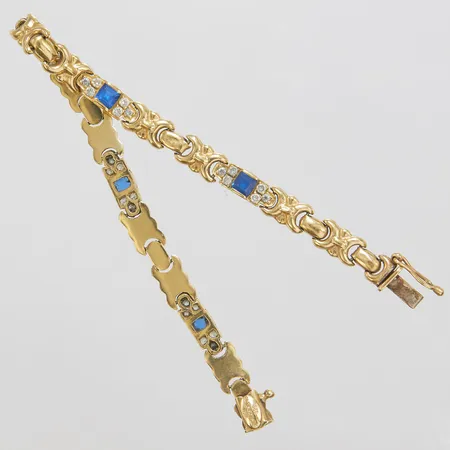 Armband med vita samt blå syntetiska stenar, längd: 19,5cm, bredd: 5,4-6,4mm, 14K Vikt: 12,4 g