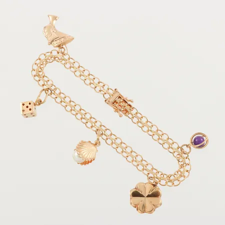Armband med 5 st berlocker, längd ca 18.5 cm, bredd 5.4 mm, 18k. Vikt: 10,7 g