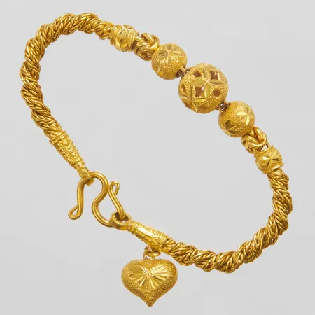 Armband med integrerade kulor samt berlock, längd: 17,8cm, bredd: 4,5-11,5mm, Thaiguld, 23K Vikt: 30,3 g