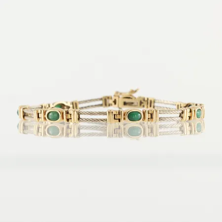 Armband med 6 st gröna stenar, längd ca 21 cm, bredd 5.3 mm, 18k. Vikt: 20,3 g
