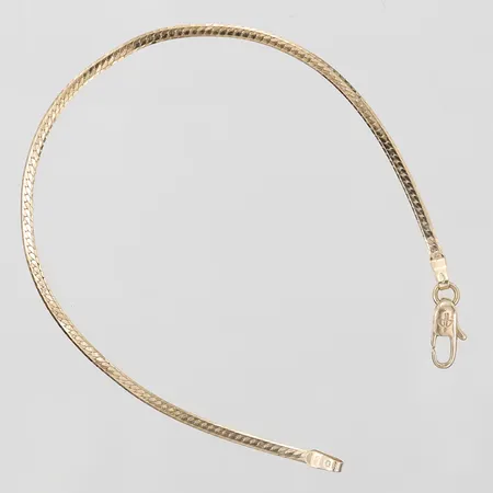 Armband, manglad Pansar med dekor i relief, längd: 18,5cm, bredd: 2mm, Balestra, brott på länken, 18K guld Vikt: 2,4 g