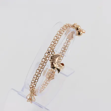 Armband X-länk med 5 st berlocker, längd ca 18.5 cm, bredd 5.1 mm, 18k. Vikt: 12,2 g