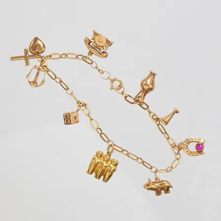 Armband, åtta berlocker, längd 20cm, bredd 3,5-22mm, buckliga berlocker, bruksslitage, 18K Vikt: 11,5 g