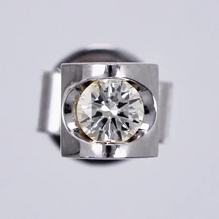 Ett udda örhänge med diamant ca 1x0,10ct, Ø ca 4,2mm, vitguld, 18K  Vikt: 0,8 g