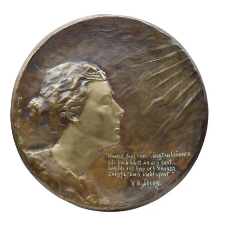 Väggplakett "Längtan" - brons, Gerda Sprinchorn (1871-1951), signerad och daterad 1897, diameter Ø32 cm, gjutarstämpel på kantrand AB Förenade konstgjuterierna, vikt strax under 2000 gram