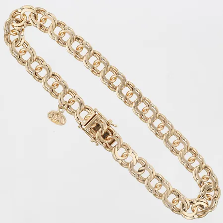 Armband Bismarck med integrerad berlock, längd: 21cm, bredd: 7mm, bruksslitage, 18K guld.  Vikt: 22,4 g