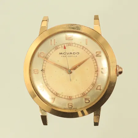 Herrur Movado Ø, 34mm, manuell mekaninsk, trög krona, håller inte tiden, 18K, bruttovikt 28,2g (guldvikt ca 10g) 