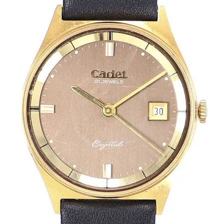 Herrur Cadet Cystal, Ø33mm, manuell, datum, gulmetall/stål, läderband ej original, bruksslitage, repor på glas och boett, tickar men ej testad för tidshållning