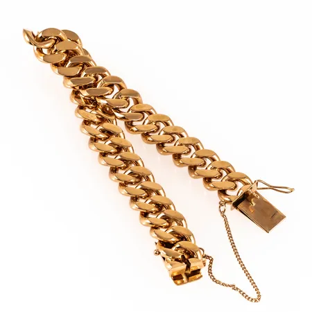 Armband, pansar i 18K guld. Det är 19 cm långt, 11,7 mm brett och väger 77,6g. Kistlås med säkerhetskedja. BOLIDEN GULD. Stämplad T8 (1945), ABJ (Juvelfabriken AB, Stockholm), 18K & kattfot.  