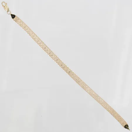 Armband X-länk, manglad, halvstelt, längd: 19cm, bredd: 6mm, 18K guld.  Vikt: 7,5 g