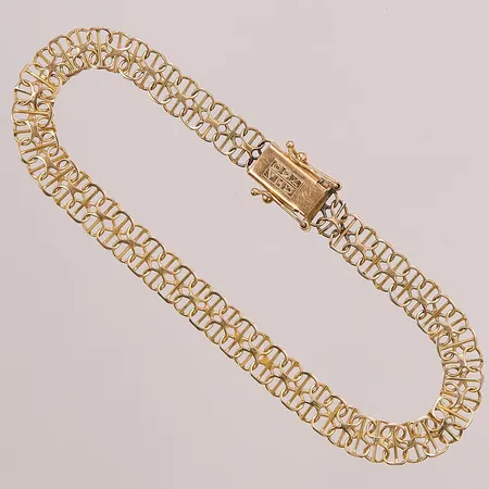 Armband, x-länk med stav, 19cm, bredd: 6,3mm, länken med viss ojämnhet vid låset,  Guldfynd, 18K, 6,9g.