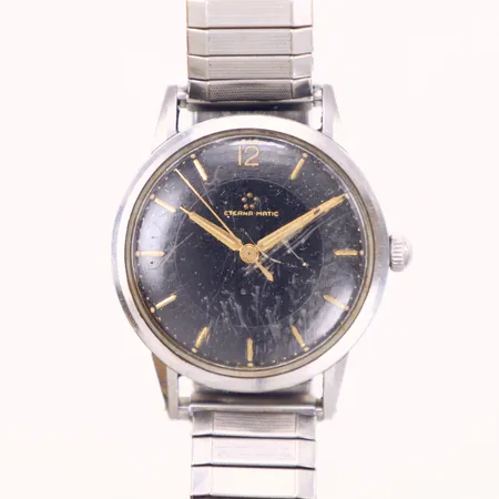 Herrur, Eterna-matic, stål, manuell, 34mm, boettnr: 3695098, kraftiga repor på plexiglas, gravyr, krona går ej att skruva, akut servicebehov, flexband i stål, inga tillbehör 