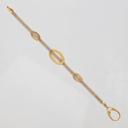 Armband, längd ca 16,5cm, bredd 3,5-12,5mm, tvåfärgad, skev, 18K Vikt: 5,2 g