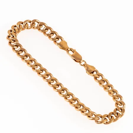 Armband, ihålig pansar i 18K guld. Det är 21 cm långt, 7 mm brett och väger 11,2g. Karbinhake. Repor och små bucklor.  