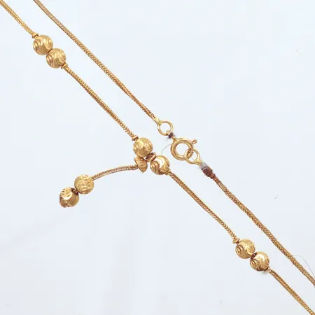 Collier, längd 45cm, detalj längd 30mm, detaljer Ø5,1mm, ojämn kedja, 21K Vikt: 7,3 g