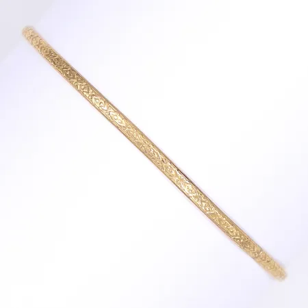 Armring med präglad dekor, Ø7cm, bredd 3mm, något ojämn i formen, 18K Vikt: 6,1 g