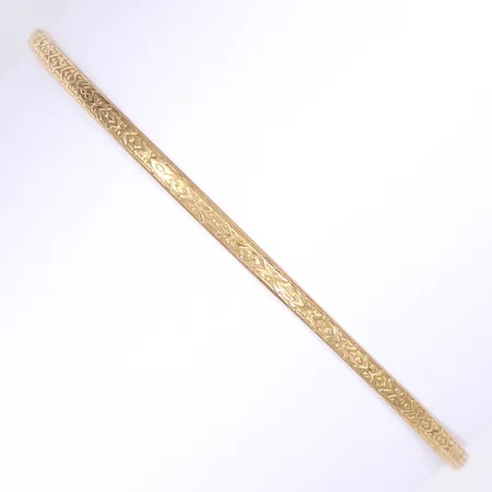 Armring med präglad dekor, Ø7cm, bredd 3mm, något ojämn i formen, 18K Vikt: 5,8 g