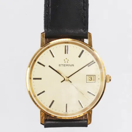 Herrur, Eterna, 18K, Ø33,5mm, quartz, datum, läderband, garantikort, defekt original etui, saknar innerkudde, personlig gravyr, batteribyte krävs, bruttovikt 25,5g