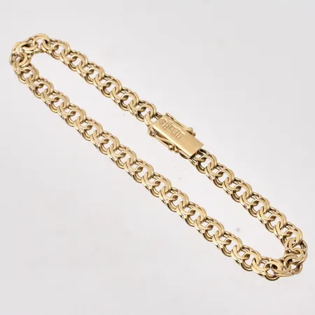 Armband i 18K guld, 18,5cm, Bismarck, bredd 5,3mm, tillverkad av Andrens Guldvaror, år 1962, vikt 9,73g.