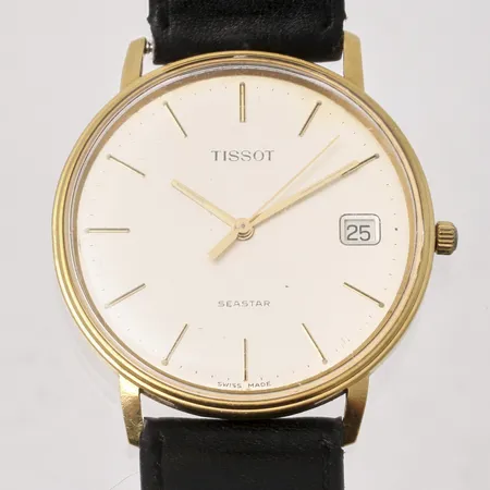 Armbandsur Tissot Seastar i 18K guld quartz, datum, gravyr: För nit och redlighet i rikets tjänst, läderband, i behov av batteribyte, inga tillberhör. Vikt: 0 g