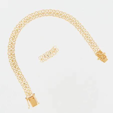 Armband X-länk med stav, ca 16,5cm, bredd ca 6mm, smärre skevhet vid lås, extra länkbitar medföljer, 18K Vikt: 6,8 g