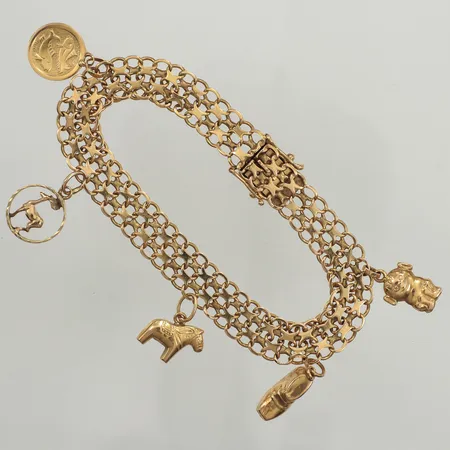 Armband X-länk med fem berlocker, längd 18,5cm, bredd 9,4mm, en berlock 14K, 18K  Vikt: 16,4 g