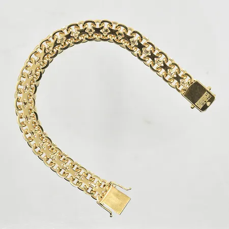Armband X-länk, längd 19½ cm, bredd 11 mm, 18K. Vikt: 36,7 g