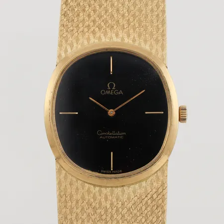 Herrur Omega Constellation Automatic,fungerar ej, bredd ca 24.3 mm, totalvikt 115.5 gram, 18k.