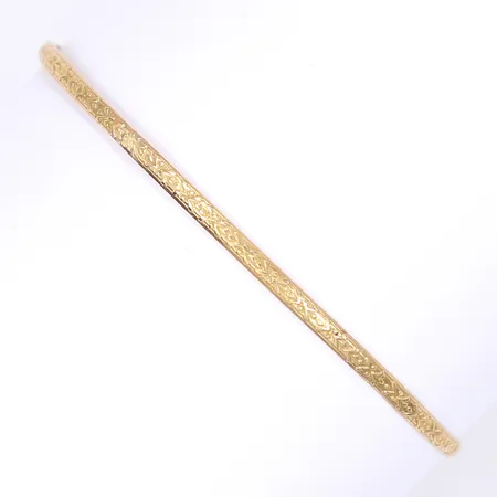 Armring med präglad dekor, Ø7cm, bredd 3mm, något ojämn i formen, 18K Vikt: 5,9 g