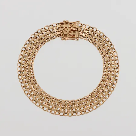 Armband x-länk, längd ca 18 cm, bredd 9.6 mm, 18k. Vikt: 13,9 g