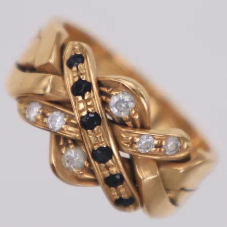 Ring med vita samt blå stenar, stl 16, bredd 3,3-10,2mm, ostämplad, 14K Vikt: 4,6 g