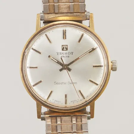 Herrur Tissot Seastar Seven manuell, Ø33,5mm, slitet plexiglas, trög uppvridning, kronan sliten, ograverad,18Ki klockan, med flexiband. Vikt: 0 g